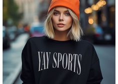 This crewneck is perfect for football fans and sports enthusiasts alike. Whether you're cheering on your favorite team at a game or just showing off your love for sports, this crewneck is a must-have. Made with high-quality materials, it's comfortable and durable for everyday wear. Get ready to show your team spirit with the Yay Sports Crewneck! SIZING -If you are looking for an over-sized look please size up 1-3 sizes from what you normally wear. -Please see sizing chart -These are unisex shirts, this means they will have a loose fit **I do not accept returns or exchanges due to sizing issues - please reference sizing chart in product images prior to purchase PRINT COLOR & SIZING -Please be aware, the color of the print in the shirt may vary slightly from what you see on your screen due t Trendy Long Sleeve Sweatshirt For Sports Season, Trendy Fleece Sweatshirt For Sports, Trendy Streetwear Sweatshirt For Sports Season, Trendy Sweatshirt For Streetwear And Sports Season, Game Day Crew Neck Sweater With Ribbed Cuffs, Varsity Sweatshirt For Game Day In Winter, College Sports Season Crew Neck Hoodie, Collegiate Sports Sweater For Fall, Fleece Sweatshirt For Sports Season Fan Apparel