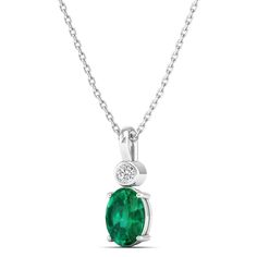 This exquisite oval-shaped emerald pendant is a true statement piece, exuding elegance and sophistication. Crafted with precision and attention to detail, the emerald is surrounded by sparkling diamonds, adding a touch of luxury to the design. Metal: 14K Gold Setting Type: Prong Rhodium Finish: Yes, on White Gold Gemstone Details: Gemstone: Emerald Shape: Oval Average Dimensions: 7.00 x 5.00 MM Quantity: 01 Average Cut: Very Good Average Color: Medium to Dark Green Average Clarity: Eye Clean Nat Fine Jewelry Emerald Necklace With Oval Diamond Pendant, Fine Jewelry Diamond Emerald Necklace With Oval Pendant, Emerald Necklace With Diamond Oval Pendant, Fine Jewelry, Oval Green Emerald Necklace With Diamond Accents, Formal Oval Emerald Necklace With Diamond, Elegant White Gold Emerald Necklace With Oval Pendant, Luxury Oval Emerald Necklace For May Birthstone, Oval Emerald Necklace With Diamond Accents, Oval Emerald Birthstone Necklace