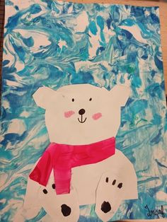 a polar bear made out of paper on top of a blue and white background with watercolors