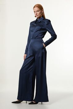 Make a well considered addition to your occasion wear wardrobe with a pair of our wide leg trousers, made in lightweight satin backed crepe fabric, with a dramatic, wide fit. The minimal design makes them easy to style, so wear them with a cropped T-shirt and trainers on a casual day, then a button up shirt and loafers for a more elevated approach. Satin Back Crepe Wide Leg Woven Trouser High Quality Satin Backed Crepe Fabric Comfortable High Waistline Flattering Wide Leg Fit Pocket Detailing New Years Eve Dresses, Loungewear Jumpsuit, Cropped T Shirt, Winter Coats Jackets