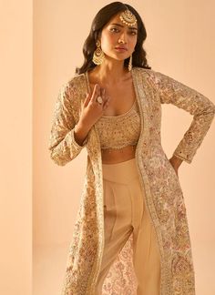 Golden Beige Embroidered Crop Jacket Set – Lashkaraa Golden Crop Top, Plazo Crop Top With Jacket, Long Sleeve Choli With Intricate Embroidery, Silk Sequined Long Sleeve Outerwear, Glamorous Long Sleeve Sets With Intricate Embroidery, Elegant Front Open Embroidered Choli, Silk Outerwear With Intricate Embroidery, Elegant Embroidered Front Open Choli, Silk Long Sleeve Sets With Sequins