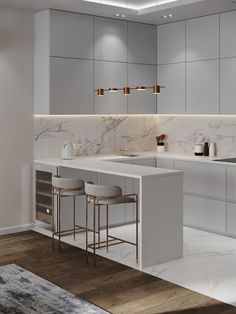 a modern kitchen with marble counter tops and bar stools