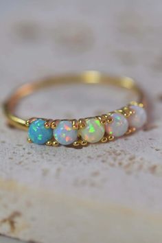 Discover the beauty of our Opal Ombre Quinn Ring. A dainty design with a touch of contemporary style, this ring is perfect for stacking. It features an ombre color way of beautiful pastel opals set in 18kt gold vermeil. Shop our online exclusives and add a pop of color to your jewelry collection. Perfect for anyone searching for opal rings or stacking rings. Opal Jewelry Ring, Ombre Jewelry, Opal Band, Feminine Women, Ombre Color, Jewelry Ring, Opal Jewelry, Opal Rings, Stacking Rings