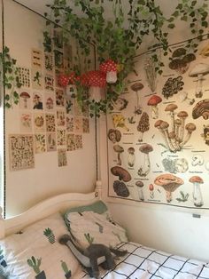 a bedroom with plants and pictures on the wall