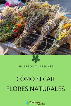 some flowers that are sitting on top of a wooden crate with the words como secar flores