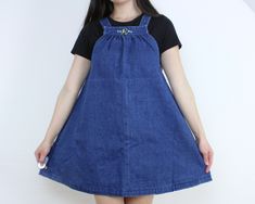 "Item Description This is a gorgeous and versatile vintage denim mini dress with a high neck/overall style and a-line cut. This is so cute for layering with or wearing as is, and so perfect for warmer weather!! I love the little \"R\" monogram on the neckline as well as the gathering of the denim at the top. This is a great addition to your wardrobe and you'll be reaching for it again and again! It is easy to wear when it's warm, and easy to throw something on over it when it's cold. This dress R Monogram, Cutest Outfits, 70s Denim, Tent Dress, Denim Color, Denim Mini Dress, It's Cold, Denim Mini, The Gathering