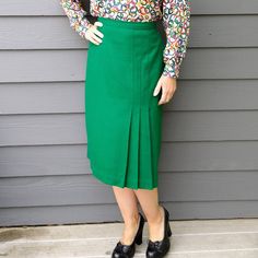 True, rich green wool or wool-blend midi skirt. No tags inside. Late 1970's/early 1980's era from the style, there is a nylon zipper in back, and a hook/bar closure. Front side kickpleat accent. Fits approximately M, waist measures 30.5", hip is 45" around, taken 9" down from front center waist. 28.25" long. Great condition, just got back from the dry-cleaner. Check out my other listings, I love to combine shipping! I cannot mark international packages as 'gift', as that is customs fraud. Dreaming of more than one item in our shop? We understand! If your multiple-item order totals $100 or more before shipping, enter coupon code MULTIDEAL at checkout and save 10%! Use the code as often as you like, and we'll keep adding new items for you to drool over. :) Green Knee-length Skirt For Formal Occasions, Green Pencil Skirt For Workwear In Fall, Fitted Green Pencil Skirt For Fall, Retro Green Skirt For Fall, Classic Green Pleated Skirt, Green Winter Pencil Skirt, Winter Green Pencil Skirt, Green Pencil Skirt For Formal Occasions, Green Lined Pencil Skirt For Work