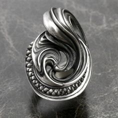 made by Dualflow abstract scale feather silver ring made in JAPAN if you want other ring gauge please contact us. Silver Artistic Rings With Artistic Design, Artistic Silver Rings With Artistic Design, Unique Silver Swirl Ring, Elegant Silver Rings With Artistic Design, Tiger Ring, Skull Ring, Ring Photos, Dream Ring, Silver Band