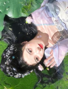 a digital painting of a woman laying on the ground