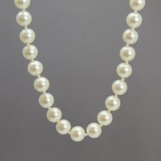 "A beautiful Signed Monet 23\" faux pearl necklace, cream color Signed Monet on The Clasp Faux 8mm Glass Pearls Gold Tone Box Clasp Hand Knotted This item is in stock and ready to ship. I found necklace in an estate sale. It is a used item. It does show some signs of wear consistent with its age. Please inspect photos closely. It is working and wearable. If you have questions please ask. I will do my best to answer them. I do not clean the jewelry while it is in my possession. The charm of vintage jewelry is the old patina and wear on the items. It is part of what makes them gorgeous! This is real vintage jewelry. Do not use liquid silver polish or harsh chemicals on pieces with stones. Those substances will cause damage. A simple silver cloth will do, taking care to avoid the stones as mu Classic Cream Pearl Jewelry, Classic Cream Pearl Necklace With Pearl Charm, Classic Cream Pearl Chain Necklace, Classic Cream Round Beads Jewelry, Classic Cream Round Bead Jewelry, Classic Cream Necklaces With Round Beads, Classic Cream Pearl Necklace, Classic Cream Necklace For Anniversary, Classic Cream Necklace With Pearl Chain