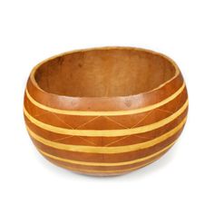 a wooden bowl sitting on top of a white surface