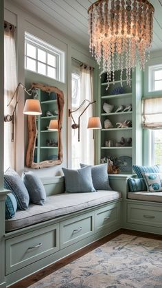 a living room with green walls and lots of pillows on the windows sills