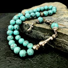 "This handmade gemstone tasbeeh; It is also known by different names such as misbaha, prayer beads, rosary, chapelet, dhikr beads, misbah, sibha, stress beads. This islamic tasbih is a great muslim gift idea. All beads are turquoise gemstone. The known proferties of natural turquoise stone are: -It keeps bones healty -It is beneficial for migraine and reduces cough -It regulates blood circulation and blood pressure. Tassel material is stainless metal. PRODUCT DETAILS Weight: 55gr Grain Shape: Ro Natural Stone Rosary With Round Beads For Meditation, Rosary With Natural Stones For Meditation, Bohemian Round Beads For Jewelry Making, Round Beads Rosary With Natural Stones For Gift, Artisan Handmade Rosary, Gift Rosary With Round Natural Stones, Polished Round Beads Rosary For Jewelry Making, Hand-strung Round Beads Rosary As A Gift, Hand-strung Rosary As A Gift