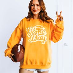 Hey football enthusiast! Ready to bring a fresh vibe to your game day wardrobe? Discover our Game Day Script Football Sweatshirt, the ultimate blend of style and comfort to express your passion for the game. Whether you're catching the action live, hosting a tailgate, or cheering from your couch, this sweatshirt promises to keep you looking effortlessly stylish. Constructed from ultra-soft, top-notch fabric, this sweatshirt offers warmth and lasting durability all season long. With its comfy fit Mama Crewneck, Football Sweatshirt, Games To Buy, Tailgate Party, Hot Mess, Hey There, Sporty Look, Game Day, Medium Length