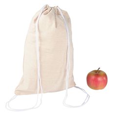 an apple is sitting next to a bag