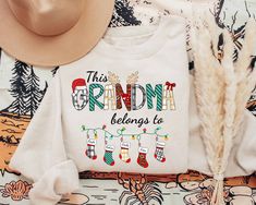 Grandma Christmas Sweatshirt, This Grandma Belongs To Shirt, Grandma Claus Shirt, Custom Grandma Shirt With Grandkids Name, Personalized Christmas Gifts For Grandma  ♥ All items are made to order. ♥ Production & shipping time:  - Production time is 3 - 5 business days from order date - Shipping time:  + Standard shipping: 5 - 7 business days + Express shipping: 3 - 5 business days ♥ Shirt Sizing: Unisex fit and run true to size. If you are unsure on sizing, please use our sizing chart in the pro Veterinary Technician Gifts, Vet Tech Shirt, Christmas Gifts For Aunts, Book Christmas Tree, Christmas Gifts For Grandma, Christmas Party Shirts, Gifts For Veterinarians, Christmas Tree Shirt, Merry Christmas Gifts