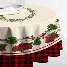 a table with a red truck and christmas trees on it