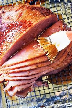 a large piece of meat sitting on top of a grill