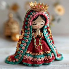 a crocheted doll with a crown on her head