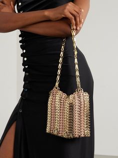 Named after the year of its release, Rabanne's '1969' bag remains iconic to this very day. This version is constructed from leather and gold-tone chainmail and has two detachable chain straps. Stow your evening-out essentials inside, like your cards, keys and lipstick. Gold Chain Link Shoulder Bag For Formal Occasions, Luxury Metal Shoulder Bag For Formal Occasions, Gold Evening Bag With Metal Hardware, Designer Gold Evening Bag With Chain Strap, Gold Clutch With Metal Hardware For Evening, Evening Bags With Gold Chain Link, Luxury Formal Metal Shoulder Bag, Gold Evening Bags With Metal Hardware, Formal Gold Metal Shoulder Bag