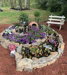 a garden with flowers and plants in it