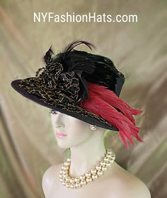 Haute Couture Black And Metallic Gold Embroidered Designer Hat For Women. This One Of A Kind Statement Dress Hat Is Embellished With A Black Bow Enhanced With A Handmade Black And Metallic Gold Embroidered Bow. Expensive Black Hackle Rooster Feathers Are Placed Within This Exquisite Bowing Topped Off With Pink Long Coque Feathers. The Feather Colors Are Between A Red And A Pink. A Black Hat Band Encircles The Crown Of This High Fashion Hat. Black Rhinestone Trim Is Placed Withing The Bowing. One Of A Kind Hat - Custom Made New Condition. Measurements: 22.5" Crown Size. Brim Is Small To Medium Sized. This Is Not A Wide Brim Hat. This Hat Is Suited For Winter Spring Summer And Fall. This Fashion Hat Is Custom Made By WomensDesignerHats.com A Division Of NYFashionHats Haute Couture Headwear. Black Brimmed Evening Hat, Luxury Pink Evening Hat, Luxury Hat-style Headpiece For Events, Luxury Vintage Hats With Feathers, Luxury Feather-trimmed Costume Hats And Headpieces For Women, Bespoke Hats, Large Brim Hat, Veiled Hats, Royal Ascot Hats