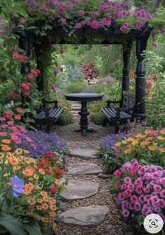 a garden with lots of flowers and benches