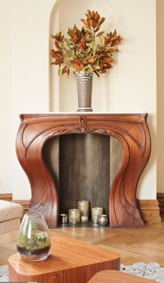 a living room filled with furniture and a fire place in the middle of a room