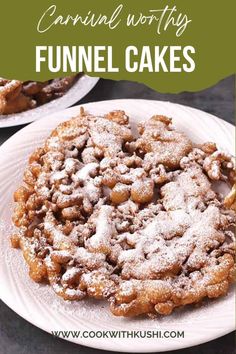 a white plate topped with funnel cakes covered in powdered sugar