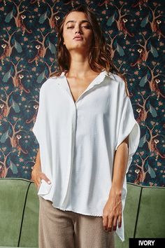 Stay comfortable and stylish in our Oversized Dolman Top. Featuring a collared button-down front and short drop-shoulder sleeves, this loose-fitting top is perfect for any occasion. Its curved hi-low hemline and textured lightweight woven fabrication add unique details to this must-have shirt. • Fabric: 100%POLYESTER First model wearing a medium 5'4 Dolman Top, Dolman Sleeve Tops, Oversized Blouse, Loose Fitting Tops, Oversized Shirt, Quality Fashion, Dolman Sleeve, Shoulder Sleeve, Everyday Look