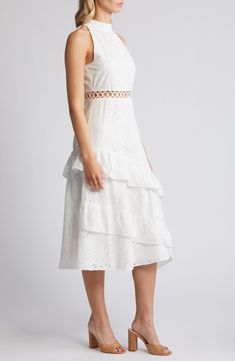 A breezy eyelet dress offers winsome charm with an embroidered waist cutout and cascading, asymmetric ruffles in an A-line silhouette. 45" to 50" center front length (size 8) Mock neck Sleeveless, with cutaway shoulders Lined 100% polyester Dry clean Imported Sleeveless Broderie Anglaise Dress For Garden Party, Sleeveless Broderie Anglaise Midi Dress For Garden Party, Sleeveless Eyelet Dress For Spring, Sleeveless Dress With Cutwork Hem For Spring, Spring Fitted Dress With Cutwork, Sleeveless Eyelet Midi Dress For Summer, Sleeveless Broderie Anglaise Midi Dress For Daywear, Fitted Summer Dress With Cutwork, Casual Tiered Broderie Anglaise Dresses