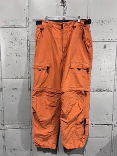 Sonoma brand soft cotton nylon blend.  Waist and cuff adjusters.  Great condition no flaws to mention  Tagged 38x32 best but please review measurements:  18" across the waist 23" across the hips 31" inseam  10" leg opening  13" rise Orange Parachute Pants, Basic Essentials, Orange Pants, Streetwear Skater, Pantalon Large, Y2k Aesthetic, Neon Orange, Grunge Fashion, Gender Neutral