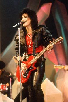 michael jackson performing on stage with his guitar