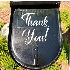 a black mailbox with the words thank you written on it