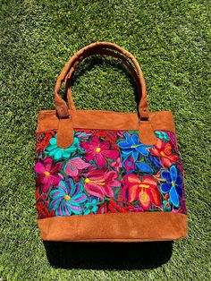 "This stunning embroidered flower tote bag is an absolute must-have. Incredible detailing with breathtaking colors that will have everyone complimenting. Beautifully made by Artisans in Mexico. Large enough to use for shopping, use as a diaper bag, school, beach, and everyday use. Please advise that each bag is handmade and each design will vary. Some of the designs might have different flower placements. If you want a specific one please message me. Measurements: 12 inches length x 15 inches wi Multicolor Floral Embroidered Tote Shoulder Bag, Multicolor Floral Embroidery Tote Shoulder Bag, Everyday Multicolor Embroidered Bag, Multicolor Floral Embroidered Tote Bag, Multicolor Floral Embroidery Bags For Daily Use, Multicolor Floral Embroidery Bag For Daily Use, Multicolor Floral Embroidered Daily Bags, Multicolor Floral Embroidery Shoulder Bag, Red Floral Embroidered Tote Bag