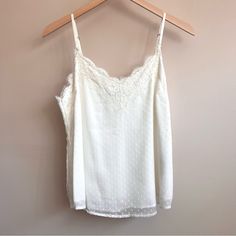 Never Worn Before - Bought Too Big. Will Fit A Medium Or A Larger Small Beautifully. A Stunning Basic To Keep In Your Collection To Dress Up Or Down. I’m Happy To Make A Separate Listing For You With A Temporarily Higher Price And Then Drop It To This Listing’s Price So You Get $4.99 Closet Clear Out Shipping! Just Comment On This Listing And I Will Set It Up For You. Comes From A Smoke-Free And Pet-Free Home. Feel Free To Check Out My Other Listings! Sign Up For Poshmark With My Code Athenasapp Summer Beige Tops With Delicate Lace, Summer Beige Delicate Lace Top, Beige Delicate Lace Summer Tops, White Delicate Lace Cami Top, White Feminine Tank Top With Delicate Lace, White Lace Camisole Top For Spring, White Lace Top Camisole For Spring, Feminine White Lace Tank Top, Elegant White Camisole For Brunch