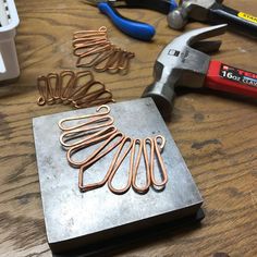 the tools are sitting on the table ready to be made into something else that looks like wire