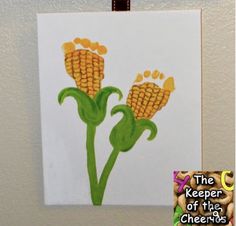 an art project with corn on the cob and words that read, the keeper of the cheerios