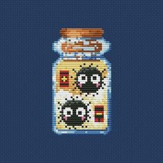 a cross stitch pattern of a jar with two cats in it on a blue background