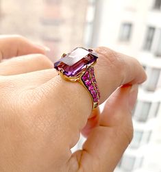 JR0204-AM 'Rain-Forest' Amethyst Emerald Cut with Pink Sapphire & Diamonds Ring in 18K Gold Stone Size: 15 x 10 mm Pink Sapphire Diamond Ring, Pinkish Purple, Purple Sapphire, Diamonds Ring, Rain Forest, Sapphire Diamond Ring, Vegas Wedding, Gold Stone, Pendant Rings