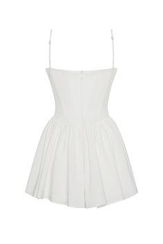 Discover the epitome of femininity in our Bellini Bustier Mini Dress. This classic, white mini dress is complimented with wire bustier cups, side pockets and cinching waistline which effortless skims down the body to a flared skirt hemline. The mini length makes it a fun and flirty dress perfect for any summer occasion! Perfer midi length? Try our "Ballerina Dress" - same style, just in midi length. Chic White Fit And Flare Corset Dress, White Ruched Corset Dress For Cocktail, White Corset Mini Dress With Fitted Bodice, White Pleated Bodice Mini Dress For Summer, White Corset Dress With Boned Bodice And Spaghetti Straps, Chic White Corset Dress With Spaghetti Straps, White Mini Dress With Spaghetti Straps And Fitted Bodice, Cocktail Mini Dress With Boned Bodice And Spaghetti Straps, White Spaghetti Straps Corset Dress With Boned Bodice