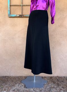 "Black Santana yarn - blend of wool and rayon UNined Fitted waist with no band Invisible zipper, in back Long maxi length, midi if taller Note the blouse is not part of the listing and is unavailable. Condition: Very good vintage. No issues of note. Came to us clean, we only aired out. See pics. Sold as is. Materials: wool, rayon Provenance: 1990-early1990s Label: St. John Evening by Marie Gray Size: labeled a 2 and about right for modern sizing. Check measurements against your bod and similar c Sisters Dress, Knit Maxi Skirt, Black Knit Dress, Antique Clothing, Cotton Skirt, Long Maxi, Fashion Pictures, Black Knit, Invisible Zipper