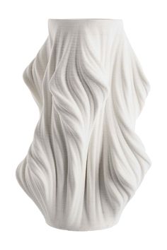 a white vase with wavy lines on it