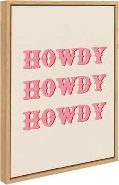 the words howdy howdy are in pink on a white canvas with wood frame