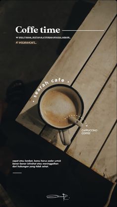 a cup of coffee sitting on top of a wooden table