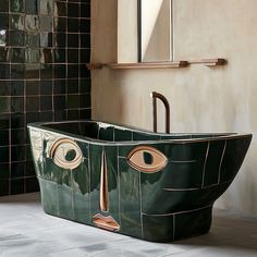 a green bathtub with an eye drawn on the side in front of a tiled wall