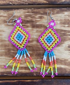 Handmade Beaded Kite Earrings These beautiful handmade earrings are made by indigenous artisans from Chiapas, Mexico. It can take up to an hour to finish every pair! These beaded earrings are unique and lightweight, and are perfect for any occasion. They also make great gifts! * Lightweight, chic, unique and original multi-colored stud earrings. * If you would like some more pictures of these lovely earrings don't hesitate to message me. Fair Trade Beaded Dangle Earrings, Handwoven Dangle Beaded Earrings, Unique Handwoven Dangle Beaded Earrings, Unique Handwoven Beaded Dangle Earrings, Multicolor Fair Trade Beaded Earrings, Traditional Beaded Chandelier Earrings For Festival, Festival Beaded Drop Earrings, Traditional Adjustable Beaded Earrings With Colorful Beads, Southwestern Handwoven Beaded Earrings For Gift