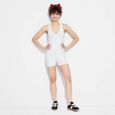 Gameday butter romper from Wild Fable™ in a solid shade with a sleeveless silhouette, wide straps and a short length. Crafted from lightweight interlock fabric with spandex. Rounded V-neckline, half-length zippered front and a racerback complete the design with sporty vibes. If you're not satisfied with any Target Owned Brand item, return it within one year with a receipt for an exchange or a refund. Wild Fable™: A look for every story. Stretch Jumpsuits And Rompers For Summer Sports, Fitted Sleeveless Bodysuit For Daywear, Summer Racerback Bodysuit In Athleisure Style, Summer Racerback Athleisure Bodysuit, Sleeveless Sports Bodysuit For Summer, Summer Athleisure Racerback Bodysuit, White Racerback Bodysuit For Summer, White Summer Bodysuit In Athleisure Style, Summer White Athleisure Bodysuit