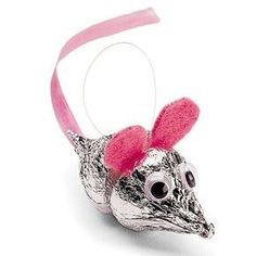 a silver mouse with pink ears on it's head