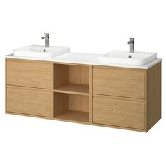 two white sinks sitting on top of a wooden cabinet